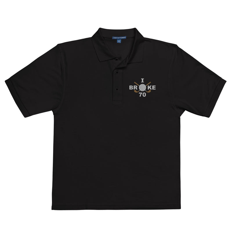 "I Broke 70" - Black Golf shirt • 65% polyester, 35% cotton pique • Relaxed fit that runs large • Flat knit collar and cuffs
