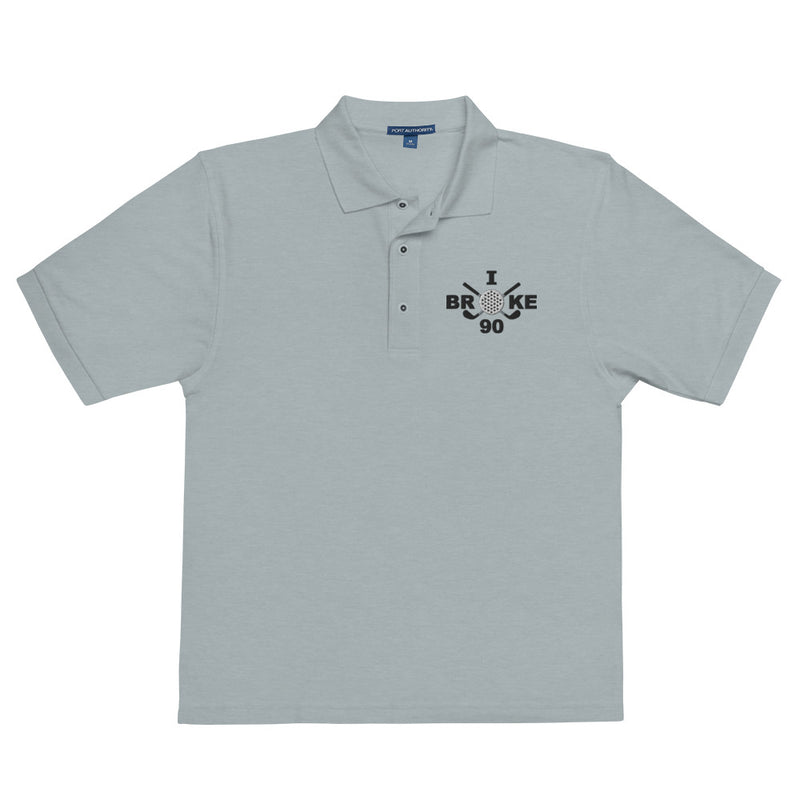 "I Broke 90" - Cool Heather Golf shirt • 65% polyester, 35% cotton pique • Relaxed fit that runs large • Flat knit collar and cuffs