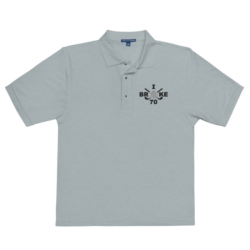 "I Broke 70" - Cool Heather Golf shirt • 65% polyester, 35% cotton pique • Relaxed fit that runs large • Flat knit collar and cuffs