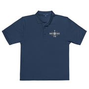 "I Broke 70" - Navy Golf shirt • 65% polyester, 35% cotton pique • Relaxed fit that runs large • Flat knit collar and cuffs
