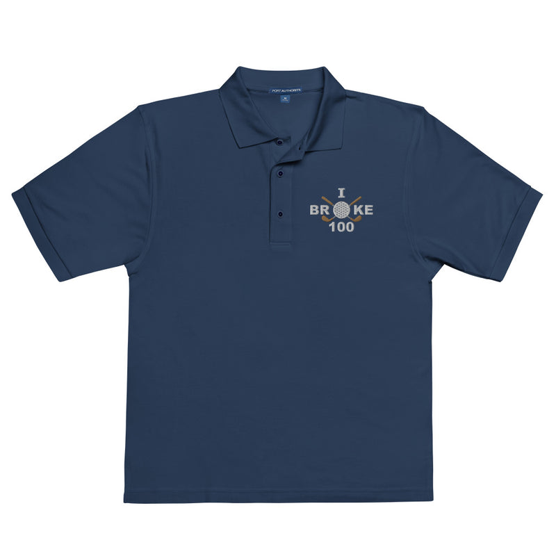 "I Broke 100" - Navy Golf shirt • 65% polyester, 35% cotton pique • Relaxed fit that runs large • Flat knit collar and cuffs