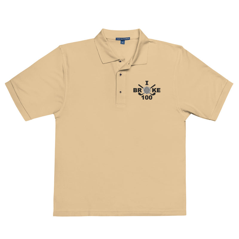 "I Broke 100" - Stone Colored Golf shirt • 65% polyester, 35% cotton pique • Relaxed fit that runs large • Flat knit collar and cuffs