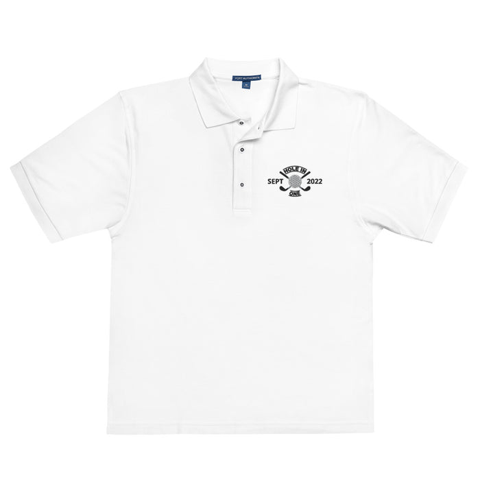 The Printful Golf Shirt - Hole in One with Personalized Month and Year Men's Polo is a white short-sleeve men's polo with a collar, three buttons, and a custom black bell graphic on the chest featuring "SEPT" and "2022.